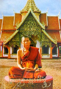 Kroo Ba Prohmajak seated in fronmt of the temple