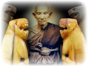 Luang Por Nok of Wat Sangkasi, with his world famous Carved Teeth Tiger Amulets