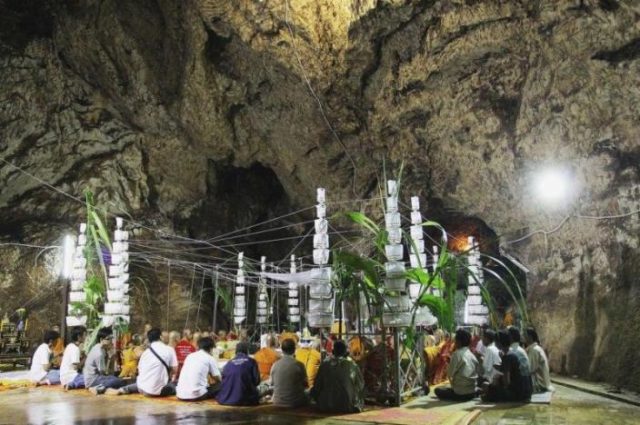 Praying within the Sacred Cave at Wat Khao Or